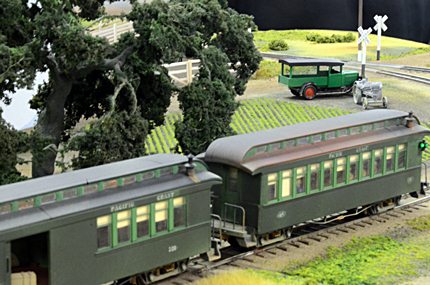 two pullman cars on a model layout